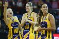 Winning combination: Lightning captain Geva Mentor holds the Super Netball trophy