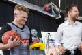 Matthew Dellavedova shot hoops with Magpies Adam Treloar (left) and Jeremy Howe (right) for charity Bluearth