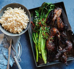 Twice-cooked sticky duck with charred Asian greens.