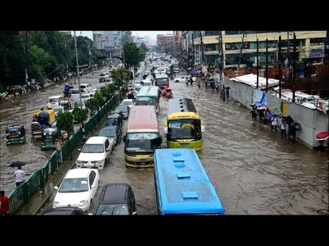 Commuters stuck in floodwaters in Bangladesh's Dhaka