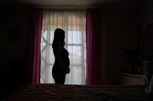 Silouette of a pregnant teen