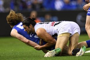 Ben Brown hit the turf head first in a tackle from Collingwood ruckman Brodie Grundy at Etihad Stadium on Saturday night.