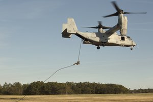 A Marine rappels out of an MV-22B Osprey at Camp Lejeune, N.C., Feb. 14, 2017. Expeditionary Operations Training Group conducted a Helicopter Rope Suspension Technique exercise for Marines from various units