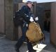 Police search the home of John Ibrahim on Tuesday morning. 