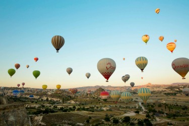 Sleeping under the stars and then waking up to this, an amazing hot-air balloon show over the fairy chimneys of ...