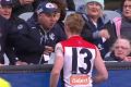 Clayton Oliver argues with a Carlton fan in the match at the MCG on Sunday. 