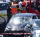 French security forces and emergency vehicles surround a car that authorities say was used in an attack on soldiers.