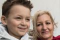 Nikola Barac, 6, with his mother Fiona Stamenkovic and brother Milan outside Westmead Institute for Medical Research. 