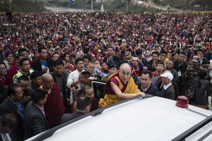 Tibetan spiritual leader the Dalai Lama, center in yellow robes, returns after teachings at the Thupsung Dhargyeling Monastery in Dirang, Arunachal Pradesh, India, Thursday, April 6, 2017.