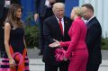 Oops: Poland's first lady Agata Kornhauser-Duda, second right, extends her hand to US first lady Melania Trump as US ...