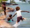 Children on Saibai island swim in the tides.