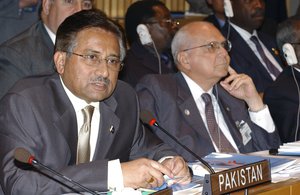 File - Pervez Musharraf (left), President of Pakistan, at a Summit on 'Action afainst Hunger and Poverty'.