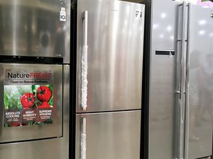 Modern refrigerators line up inside an appliances store. Taken on June 2017.