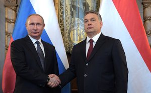 File - Handshake between Prime Minister of Hungary Viktor Orban and Russian President Vladimir Putin in Budapest, Hungary, 2 February, 2017.