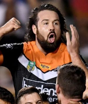 Party time: Wests Tigers players celebrate after the final try of the game.