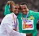 Ethiopia's Muktar Edris (centre) celebrates 5000-metre gold with silver medalist Mo Farah, left, and bronze medalist ...