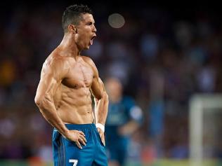 Cristiano Ronaldo flexes after scoring against Barcelona.