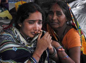 Relatives mourn the death of a child at Baba Raghav Das Medical College Hospital in Gorakhpur, in the northern Indian state of Uttar Pradesh, Saturday, Aug. 12, 2017.