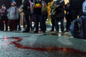 A young indigenous man was arrested after spilling red paint on Flinders Street.