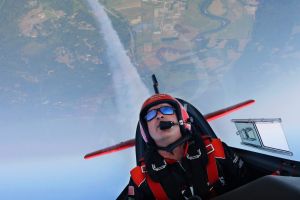 Stunt pilot John Klatt, who files with the Jacks Link's aerobatic team, trails smoke as he flies his Extra 300L airplane ...