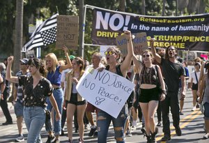 Demonstrators march in downtown Los Angeles on Sunday, Aug. 13, 2017.