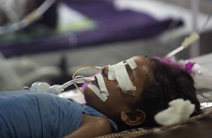 A child receives treatment at the state-run Baba Raghav Das Medical College Hospital where 35 children died in three days in Gorakhpur, Uttar Pradesh, India, Sunday, Aug. 13, 2017.