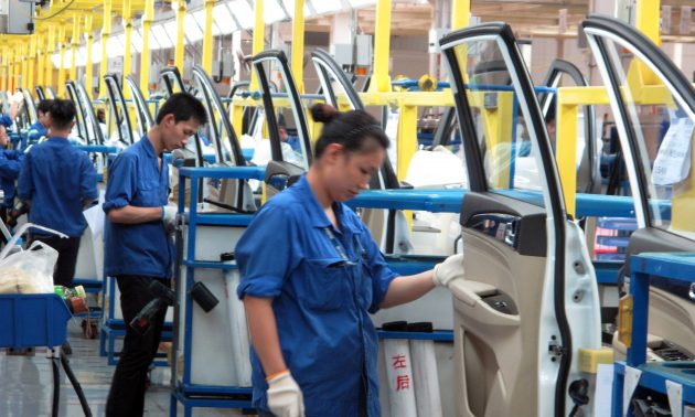 Employees on a production line inside a factory of Saic GM Wuling, in Liuzhou, Guangxi Zhuang Autonomous Region, China, June 19, 2016. REUTERS/Norihiko Shirouzu