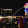 Singapore's iconic Merlion statue (R) is projected with a light-art installation by Danny Rose Collection of France titled "The Body of the Sea" during media preview for the iLight Marina Bay festival in Singapore on March 1, 2017. Photo: AFP/Roslan Rahman