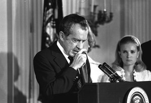 Richard Nixon performs the last acts of his devastated presidency in the White House East Room, August 9, 1974, as he bids farewell to his Cabinet, aides, and staff