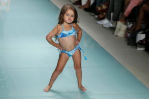 Model Taylen Biggs, 3, walks down the runway wearing Lybethras swimwear at a FUNKSHION fashion show.