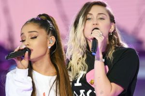 Ariana Grande, left, and Miley Cyrus perform at the One Love Manchester tribute concert in Manchester on Sunday, June 4.
