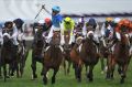 Zac Purton celebrates winning the  2014 Caulfield Cup on Japanese horse Admire Rakti.