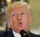 US President Donald Trump speaks to the media in the lobby of Trump Tower in New York.