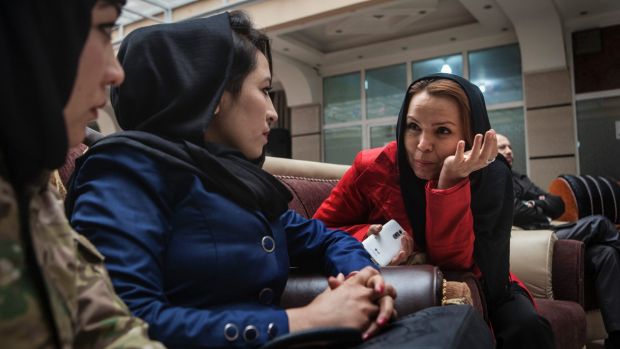 Zahra Yaganah, right, an activist, writer and divorced mother of two teenagers, speaks with Fatima Qasemi, left, and ...