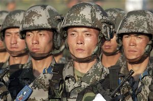 Chinese soldiers march during a parade after joint military exercises at Chebarkul testing range Friday, Aug. 17, 2007. Russian and Chinese forces on Friday held their first joint maneuvers on Russia's territory, an exercise intended to demonstrate their growing military ties and a shared desire to counter U.S. global clout. The war games in Russia's southern Ural Mountains involved some 6,000 troops from Russia and China and also a handful of soldiers from four ex-Soviet Central Asian nations that are part of the Shanghai Cooperation Organization, a regional group dominated by Moscow and B