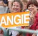 Supporters hold a sign as German Chancellor Angela Merkel speaks during an election campaign stop in Koblenz, Germany, ...