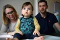 Clementine Ritchie-Barnes with her parents, Emily Ritchie and Lachlan Barnes at the Royal Children's Hospital.  