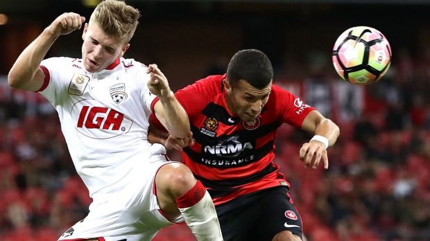 Stalemate: Riley McGree competes for the ball against Jaushua Sotirio.