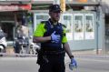 A police officer cordons off a street in Barcelona, Spain.