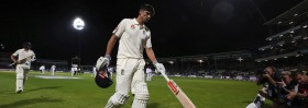 England's Alastair Cook walks off after the close of play against West Indies during day one of the first day-night Test ...