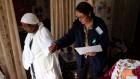 An International Fellowship of Christians and Jews volunteer with an elderly Israeli during the charity's Operation Winter Warmth (photo credit: Oren Nachshon, IFCJ)