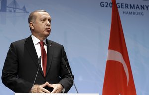 Turkish President Recep Tayyip Erdogan addresses the media during a press conference at the end of the G-20 summit in Hamburg, northern Germany, Saturday, July 8, 2017. The leaders of the group of 20 meet July 7 and 8.