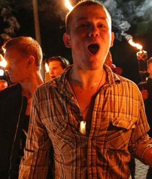 White nationalist groups march with torches through a university campus in Charlottesville.