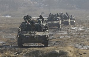 FILE - In this Jan. 11, 2015 file photo, South Korean army K-55 self-propelled artillery vehicles move during a military exercise near the demilitarized zone between the two Koreas in Paju, South Korea.