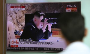 A man watches a TV screen showing a local news program reporting about North Korea's missile firing with an image of North Korean leader Kim Jong Un, at Seoul Train Station in Seoul, South Korea, Wednesday, July 5, 2017.