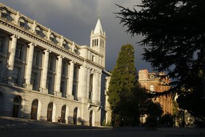 File - In this Dec. 21, 2014 file photo, late light falls on Wheeler Hall, South Hall and the Campanile on the University of California campus in Berkeley, Calif. University of California officials have proposed limiting nonresident enrollment to 20 percent of all undergraduate students, in an effort to prioritize in-state applicants. The proposal introduced Monday, March 6, 2017, would be the first limit of its kind for the 10-campus public university. The Board of Regents will consider it starting next week. (AP Photo/Eric Risberg, File)