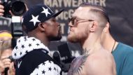 Face off: Floyd Mayweather Jr. and Conor McGregor face each other during a promotional event.