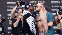 Face off: Floyd Mayweather Jr. and Conor McGregor face each other during a promotional event.