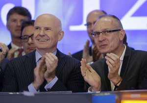 Gerard Baker, left, Editor in Chief of The Wall Street Journal, and Robert Thomson, CEO of News Corp, participate in the opening ceremonies at the Nasdaq MarketSite in New York, Tuesday, July 8, 2014