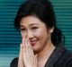 Yingluck Shinawatra thanks supporters as she arrives at the Supreme Court for her final statements on August 1.